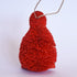 Decorative Bristle Kiwi bird ornament with glittery red finish on a white background