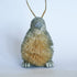 Decorative Bristle Kiwi bird ornament with glittery finish on a white background