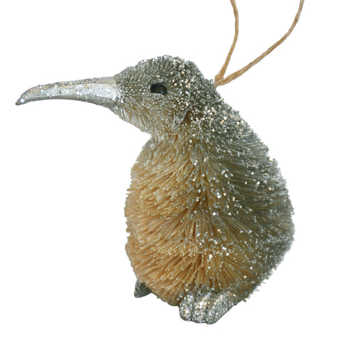 Decorative Bristle Kiwi bird ornament with glittery finish on a white background