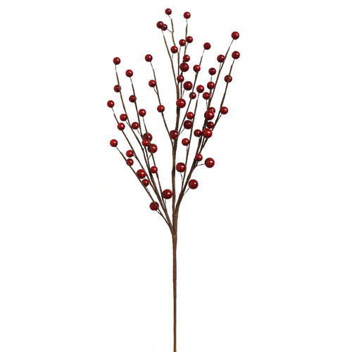 Artificial red berry branch on a white background