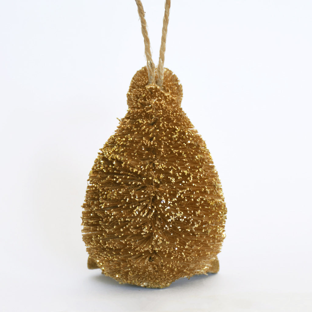 Decorative Bristle Kiwi bird ornament with glittery gold finish on a white background