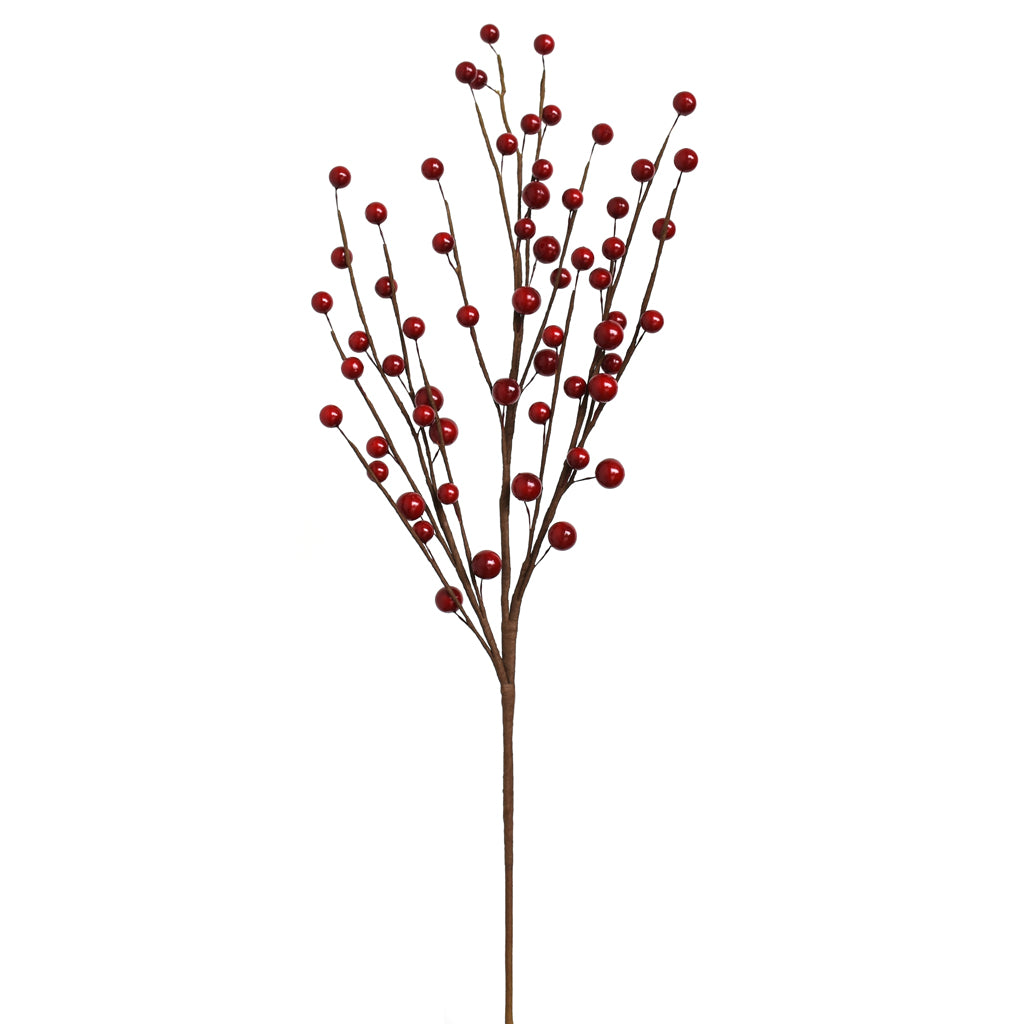 Artificial red berry branch on a white background